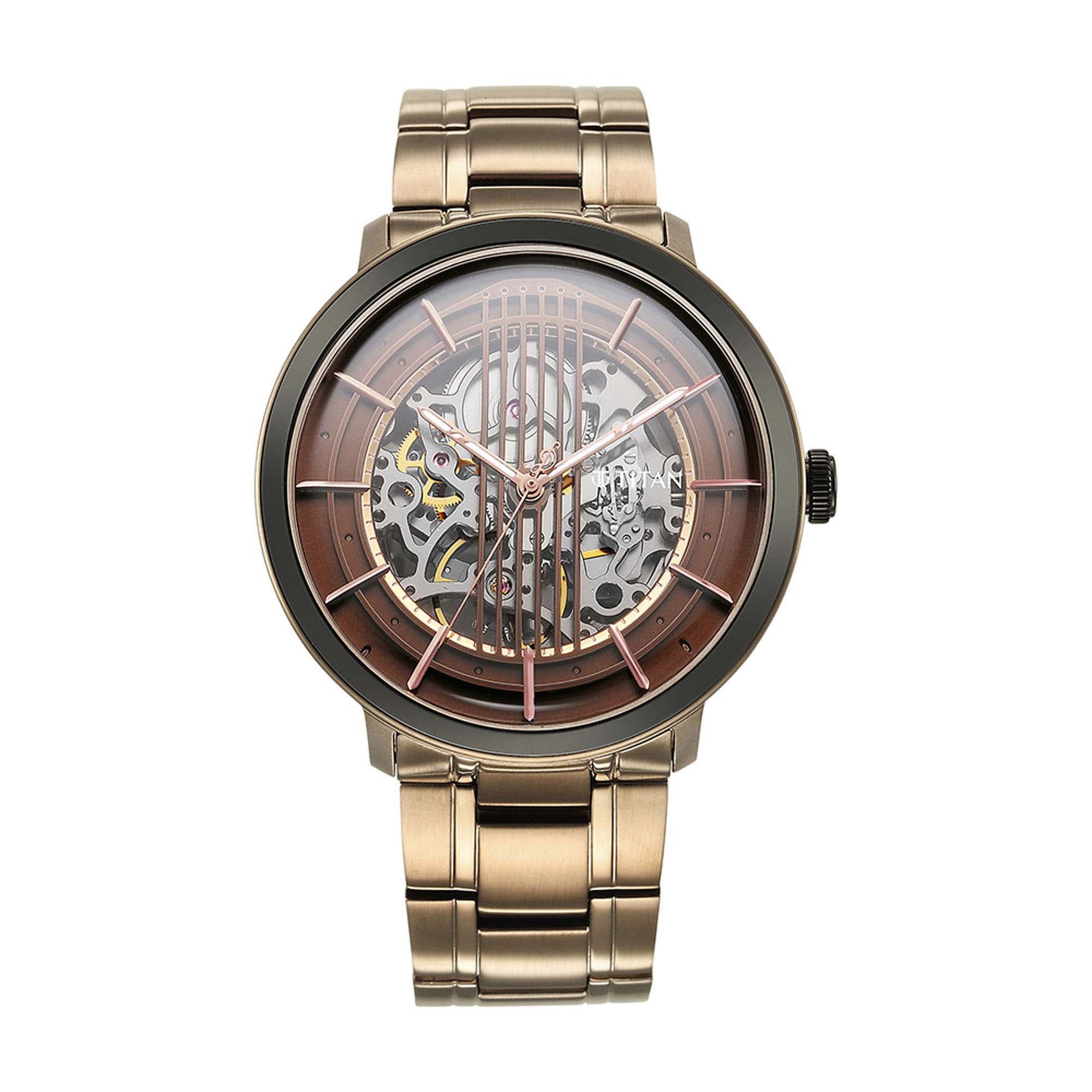 Titan Quartet automatic men’s watch with brown skeleton dial & brushed golden stainless steel strap.