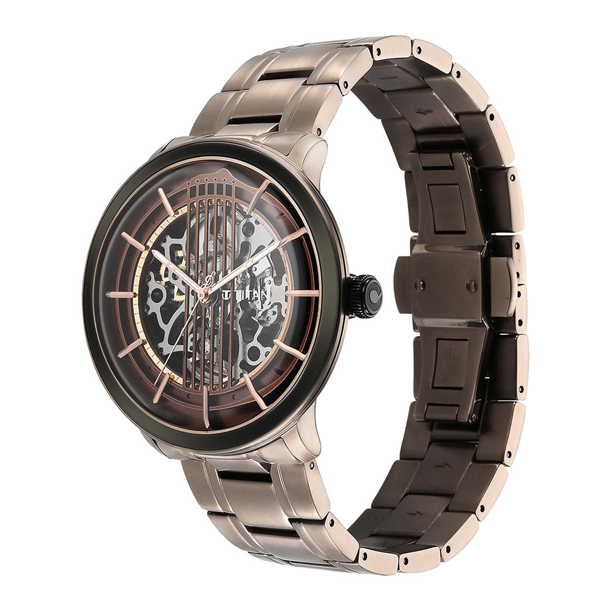 Angled view showing Titan Quartet automatic watch with brown openwork dial & stainless steel strap.