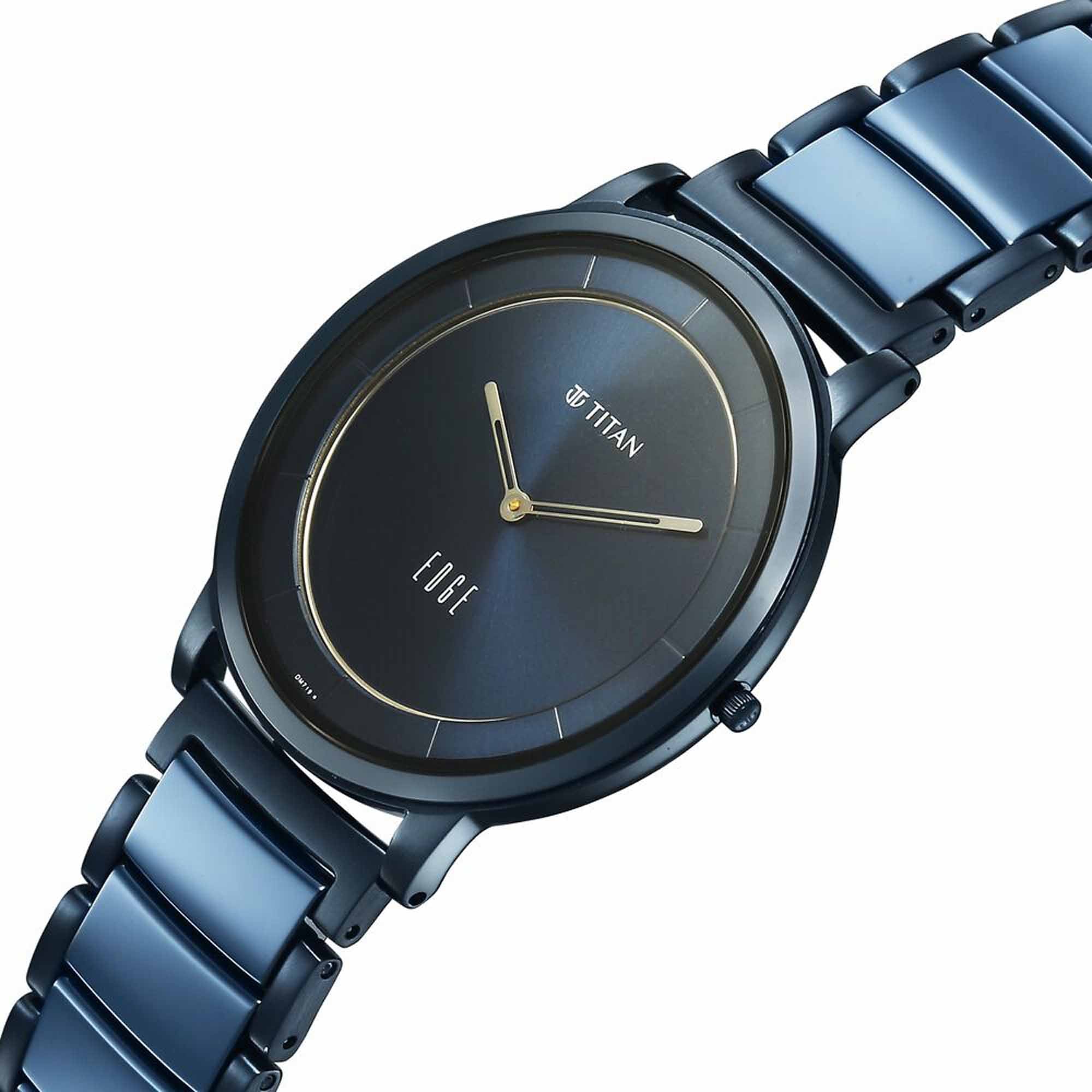 Angled view of Titan Edge Melange blue dial analog watch with ultra-slim case & steel ceramic strap.