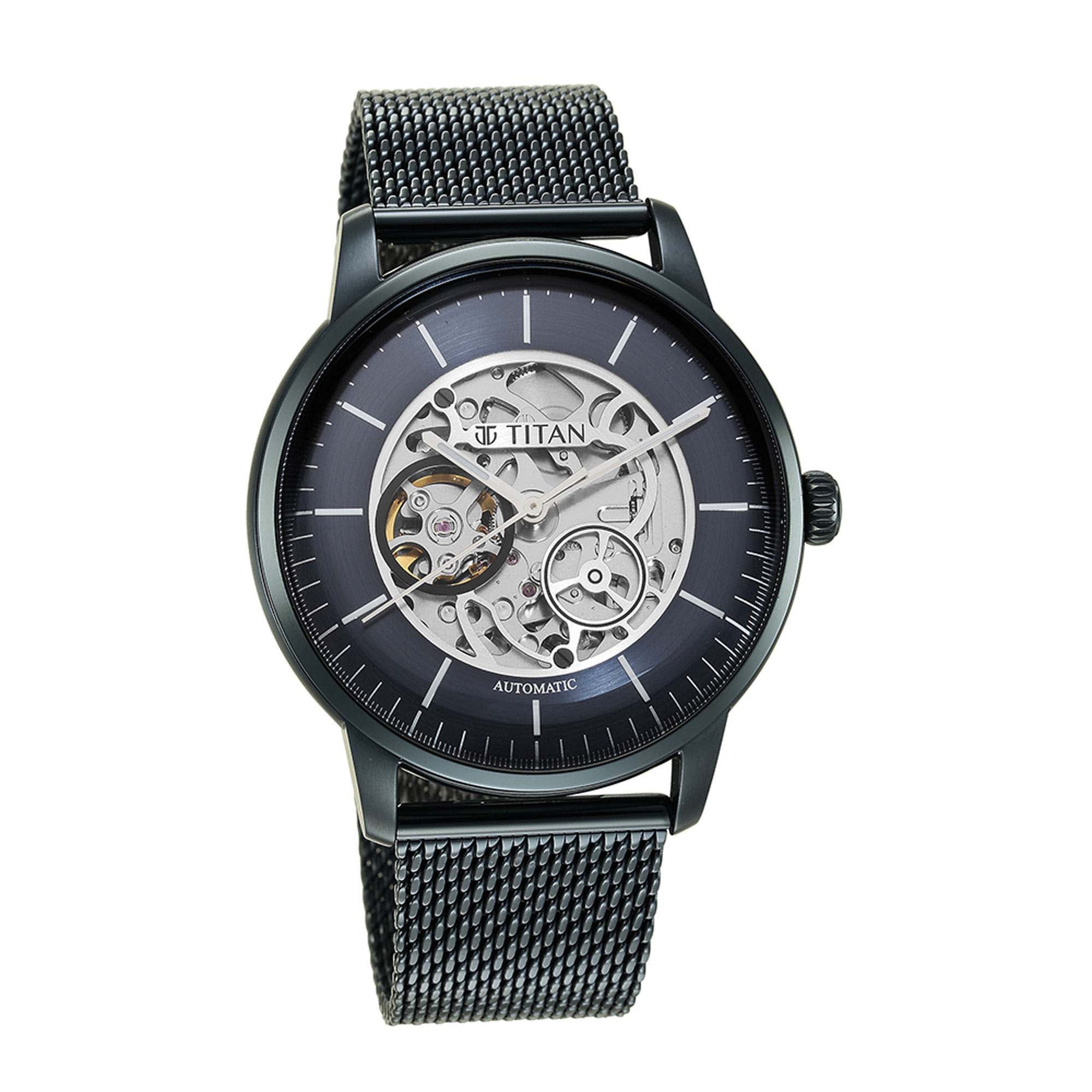 Bold Titan automatic watch for men with blue dial skeleton display and sleek stainless steel strap!