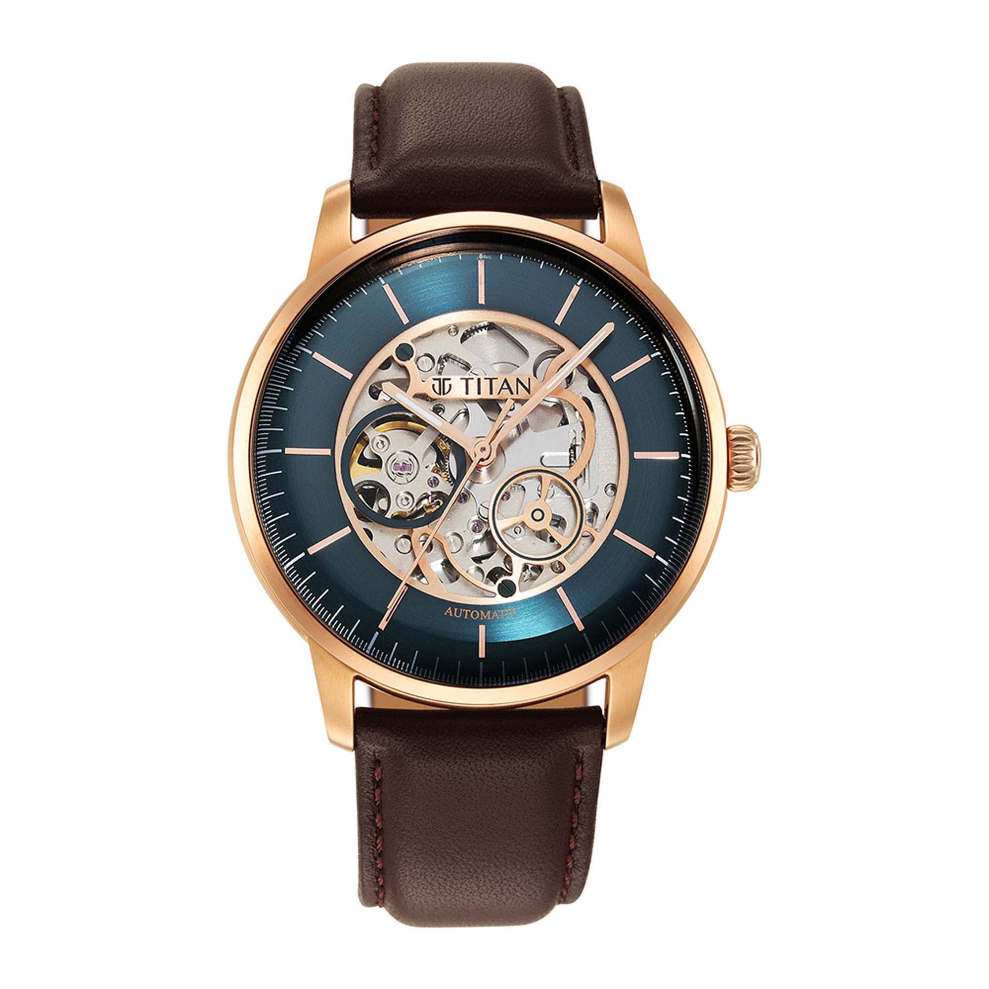 Elegant Titan automatic watch for men with green skeleton dial, rose goldcase & brown leather strap.