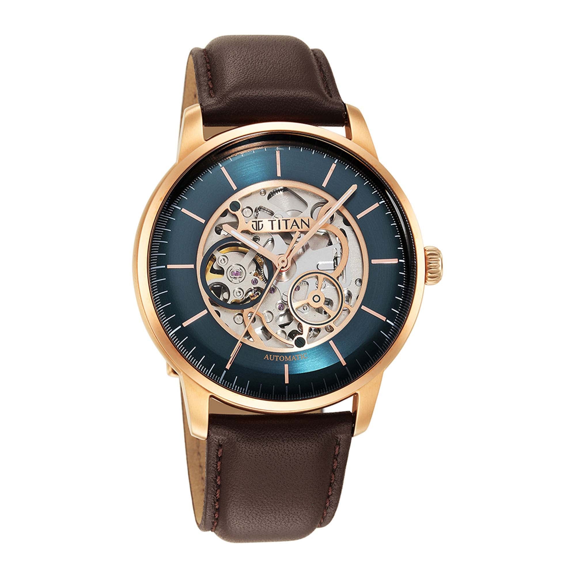 Classic Titan skeleton automatic watch for men with green dial, rose gold case, brown leather strap.