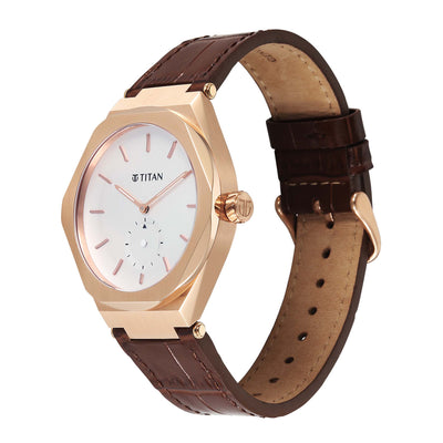 Polygonal Gold-tone Titan Contour men's analog watch from a high-angle view, showing the crown.