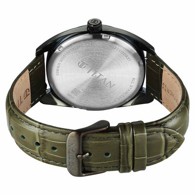 Back view reveals Titan watch stainless steel caseback with engraved branding & green strap buckle.