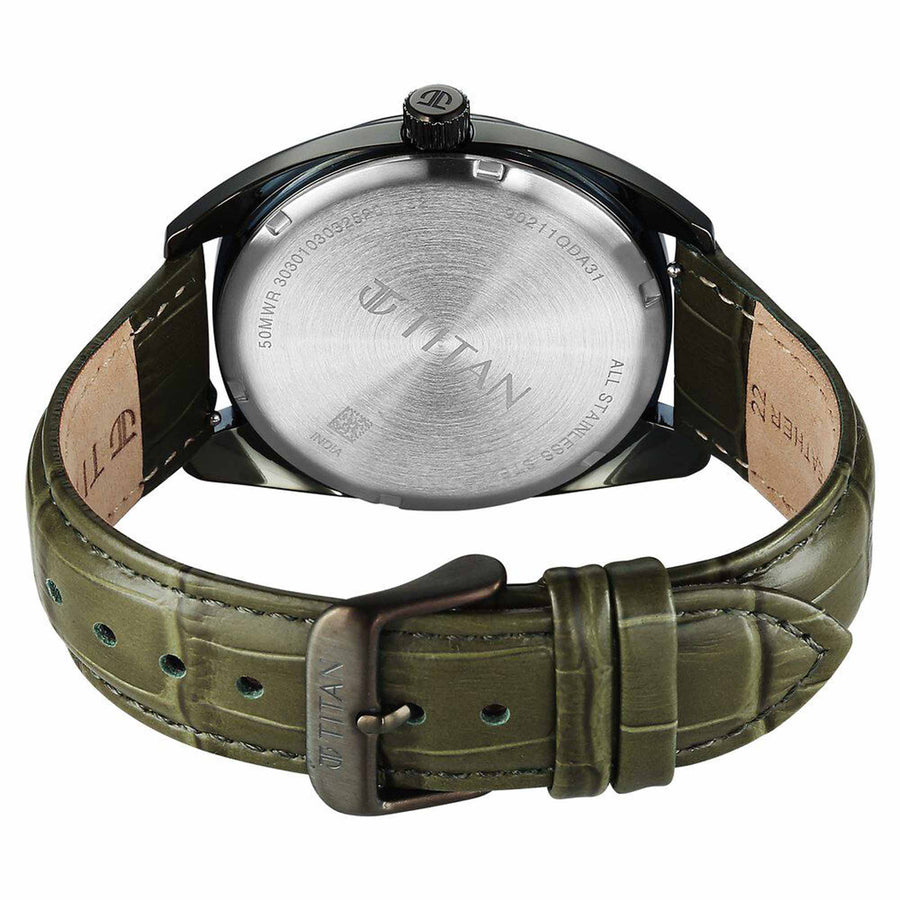 Back view reveals Titan watch stainless steel caseback with engraved branding & green strap buckle.