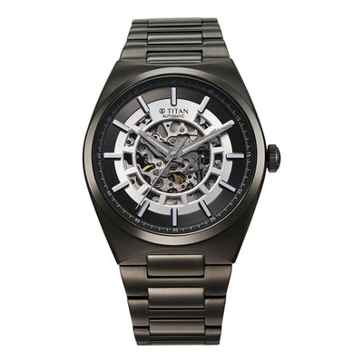 Front-facing Titan Nexus automatic analog watch for men showcasing skeletal gun dial & steel strap.
