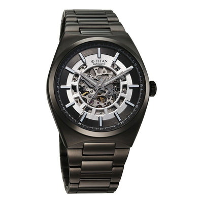 Detailed look of Titan Nexus skeletal automatic analog watch for men with stainless steel strap.