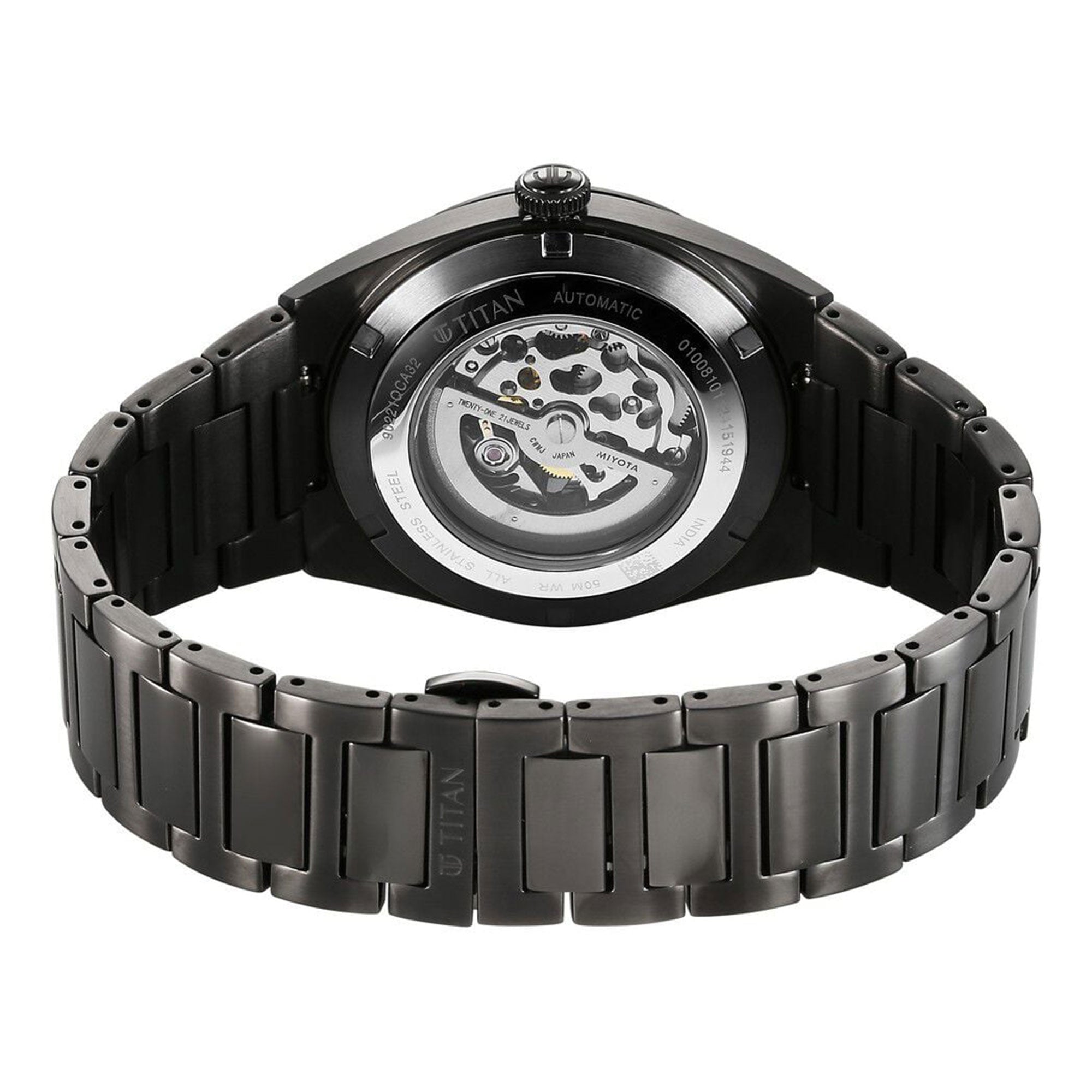 Rear view reveals a Titan automatic analog watch for men with a transparent case back & steel strap.